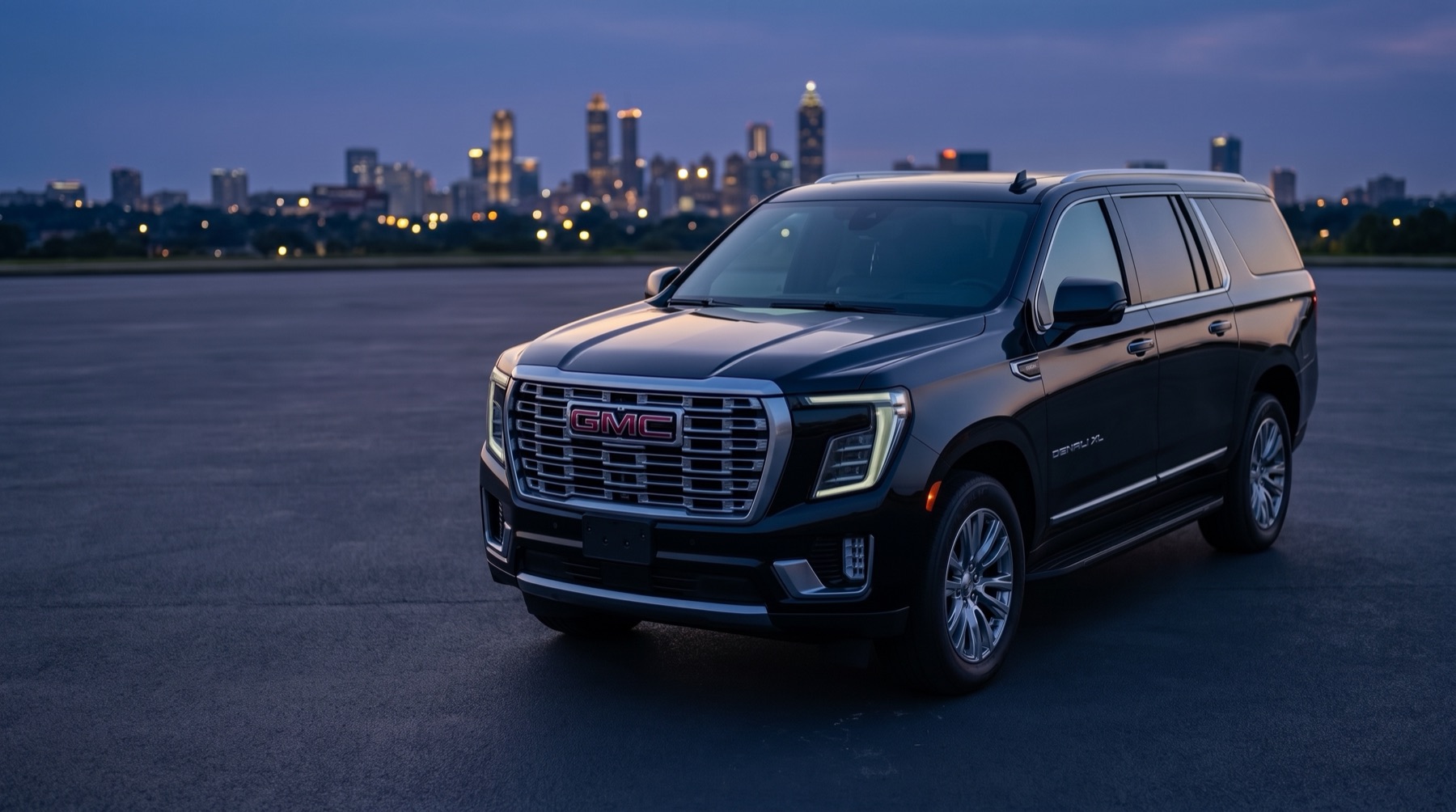 Luxivo's black GMC Yukon XL Denali at dusk, front three-quarter view